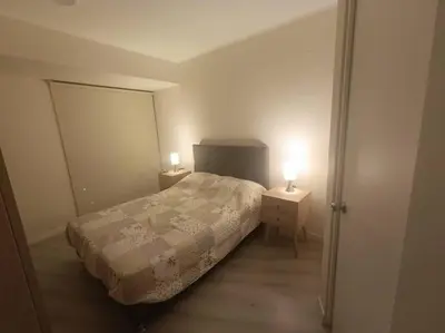a bedroom with a bed and two night stands at Piso 31, Último piso, con vista Panorámica in Lima