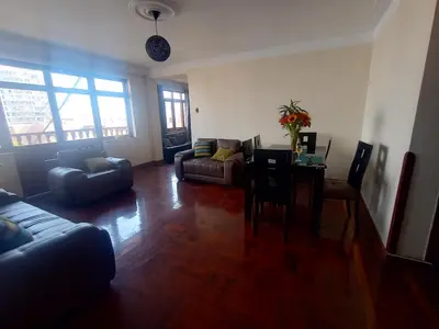 a living room with a couch and a table and chairs at Eli Travelers House in Lima