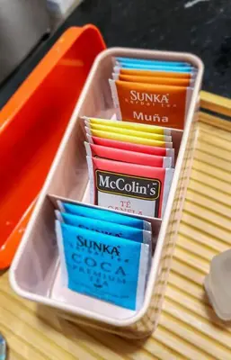 a plastic container filled with colored pencils and chopsticks at Apartamento completo en Barranco in Lima