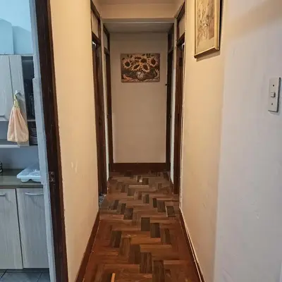 a hallway with wooden floors in a house at Hospedaje Rochi House - Cusco- En el Corazón del Cusco in Cusco