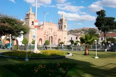 a pink church with a palm tree in front of it at Incasol Tower 
