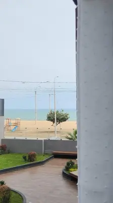 a view of a beach from a building at Hermoso departamento in Lima