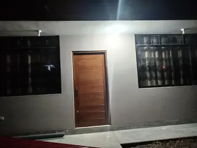 a room with a door and two pictures on the wall at Yompor's haus in Oxapampa