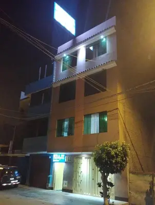 a building with a car parked in front of it at night at Francisco D Francisco in Lima