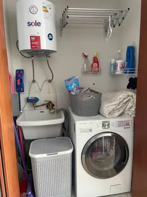 a laundry room with a washing machine and a sink at Departamento en Miraflores, Lima in Lima