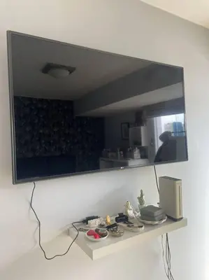 a mirror on the wall of a room with a counter at Departamento en Miraflores, Lima in Lima