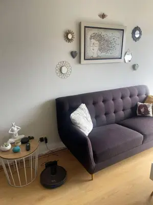 a living room with a couch and a table at Departamento en Miraflores, Lima in Lima