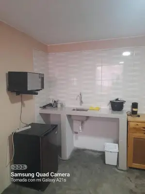 a kitchen with a counter and a sink in a room at 201 Comfy Apt WiFi kitchen SmartTV Central at Callao in Lima