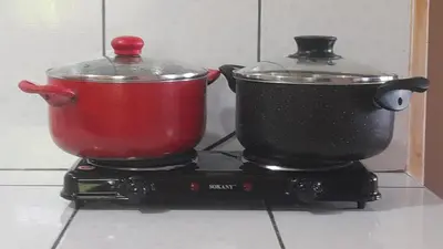 a pot and a container on a stove at 201 Comfy Apt WiFi kitchen SmartTV Central at Callao in Lima