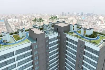 an aerial view of a tall building with plants on its roofs at Private Apartament in LINCE near MIRAFLORES & REBAGLIATI HOSPITAL with POOL, GYM, PRIVATE PARK ! in Lima