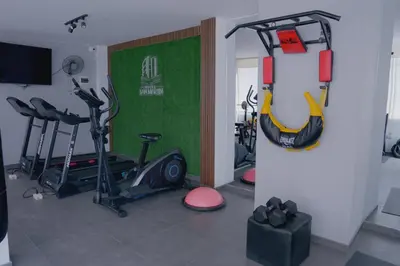 a room with a gym with exercise equipment in it at Hotel San Martín in San Juan de Marcona