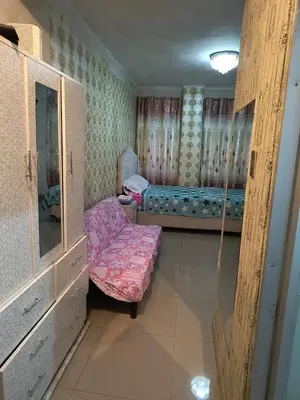a room with two beds and a bench in it at ESTUDIO COMPLETO en el CENTRO HISTORICO de LIMA in Lima