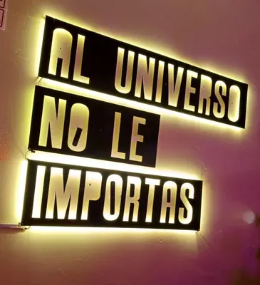 a neon sign that says all universities no le computers at Casa Turística Monumental in Lima