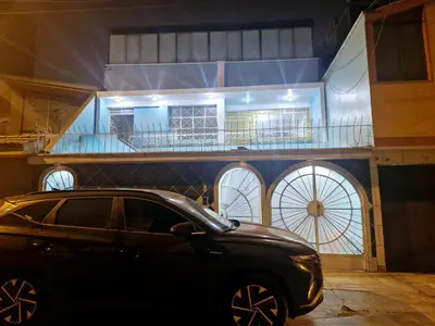 a black car parked in front of a house at Apartamento-Santa Anita, Villa Caly in Lima