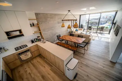 a kitchen with a table and a dining room at Aldea 2BR Ocean View Luxury for 4ppl or 2 couples in Paracas