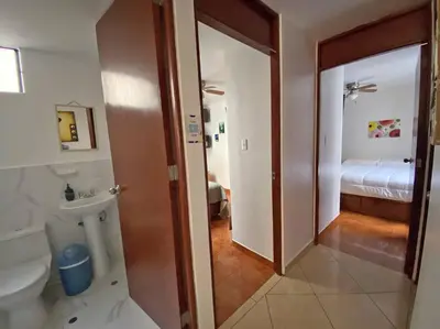 a bathroom with a toilet and a sink in a room at Cerca a las universidades San Marcos y Católica in Lima