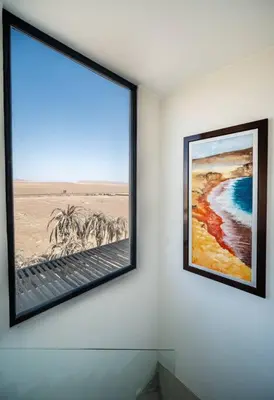 two framed pictures on a wall in a room at Aldea 1BR Penthouse wtih Private Pool and Views for 2 in Paracas