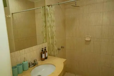 a bathroom with a sink and a shower at Bello Familiar Miraflores Larcomar Kennedy in Lima
