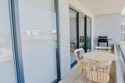 a dining room with a table and two chairs at Aldea 2BR Boho Style for 4 with Gym, Pool and Cowork in Paracas