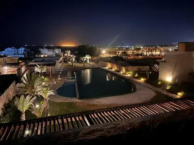 a view of a pool at night at Aldea 2BR Family, Big FrontYard for 6 with Gym and Pool in Paracas