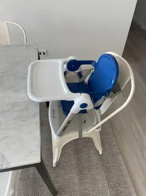 a blue and white chair sitting next to a table at Aldea 2BR, Service Room and Ocean View for 7 in Paracas