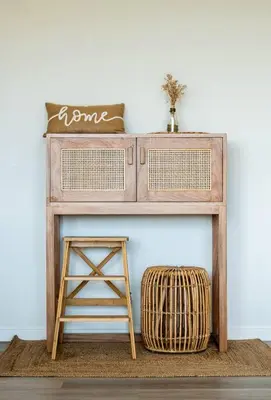 a wooden console table with a stool next to a wall at Aldea 2BR Ocean View and Kamado BBQ for 6 in Paracas