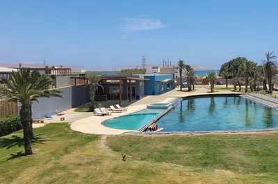 an overhead view of a swimming pool at a resort at Aldea 2 Bedroom with Private Sauna for 4 in Paracas