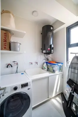 a kitchen with a washing machine and a sink at Aldea 1BR Romance Seascape for 2 in Paracas