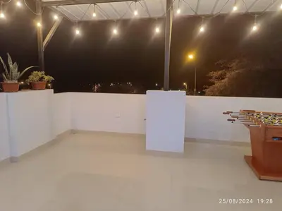 a white room with a white wall and lights at MarsHouse in Chirimoyo