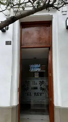 a door to a building with a sign on it at Hostal El Rey in Lima
