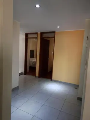 an empty room with a room with a bed in it at Hermoso Departamento en Pueblo Libre in Lima