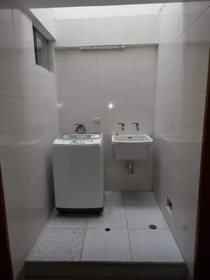 a small bathroom with a sink and a toilet at Hermoso Departamento en Pueblo Libre in Lima