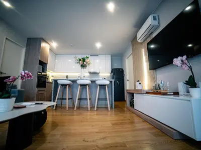 a kitchen with two bar stools and a counter at Beautiful and Well Located in Lima