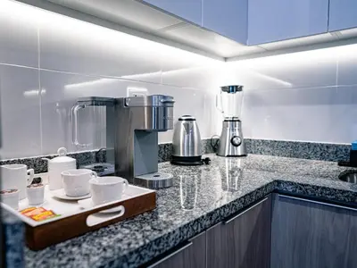 a kitchen with a coffee maker on a counter at Beautiful and Well Located in Lima