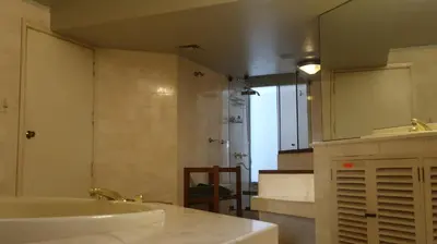 a bathroom with a sink and a large mirror at Penthouse in the centre of Miraflores in Lima