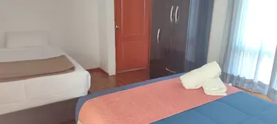 a bedroom with a bed with a pillow on it at Anata Hotel in Cusco