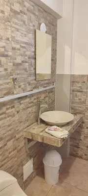 a bathroom with a sink and a mirror at Anata Hotel in Cusco
