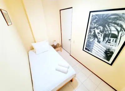 a room with a bed and a picture on the wall at FlatTOP San Isidro City View Lima 3B 1804 in Lima