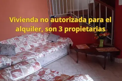 a living room with a couch and a table at Hermanas Pimentel in Ica