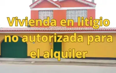 a sign on the side of a building at Hermanas Pimentel in Ica