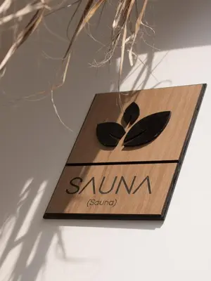 a wooden sign with two spoons on it at Narea San Bartolo in San Bartolo