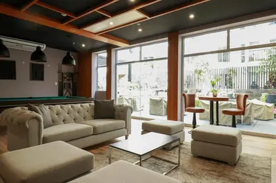 a living room with a couch and a pool table at Studio 4 by Wynwood House in Lima