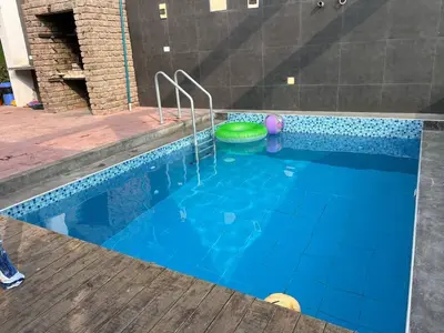 a swimming pool with a frisbee in it at Ali Home in Punta Negra