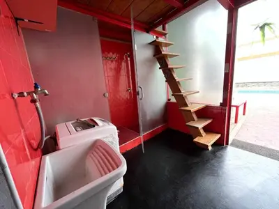 a bathroom with a sink and a toilet and a staircase at Ali Home in Punta Negra
