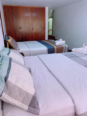 two beds sitting next to each other in a room at P2 Habitación Privada doble Miraflores, LIMA in Lima
