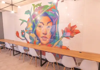 a large mural in a room with chairs at Maravilla en barranco BR1 in Lima