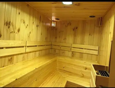 an empty sauna with wood paneled walls and ceilings at Departamento en PLAYA San Bartolo in San Bartolo