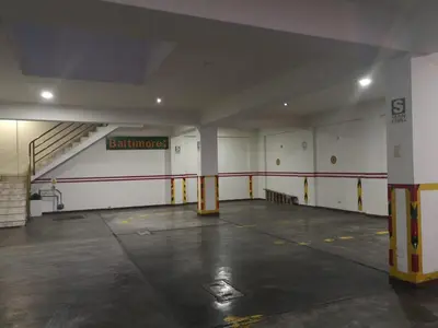 an empty parking garage with a gym with a staircase at Hs Baltimore in Lima