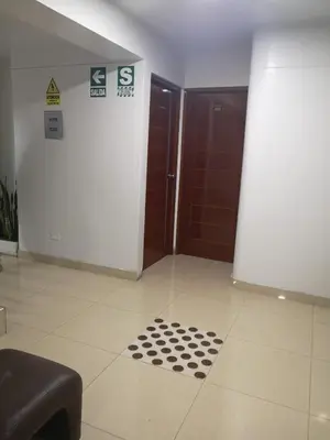 a room with a door and a drain in the floor at Hs Baltimore in Lima
