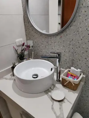 a bathroom with a white sink and a mirror at El Libertador Apartment Miraflores in Lima